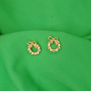 Aretes de zirconia con moño - chapa de oro 18k